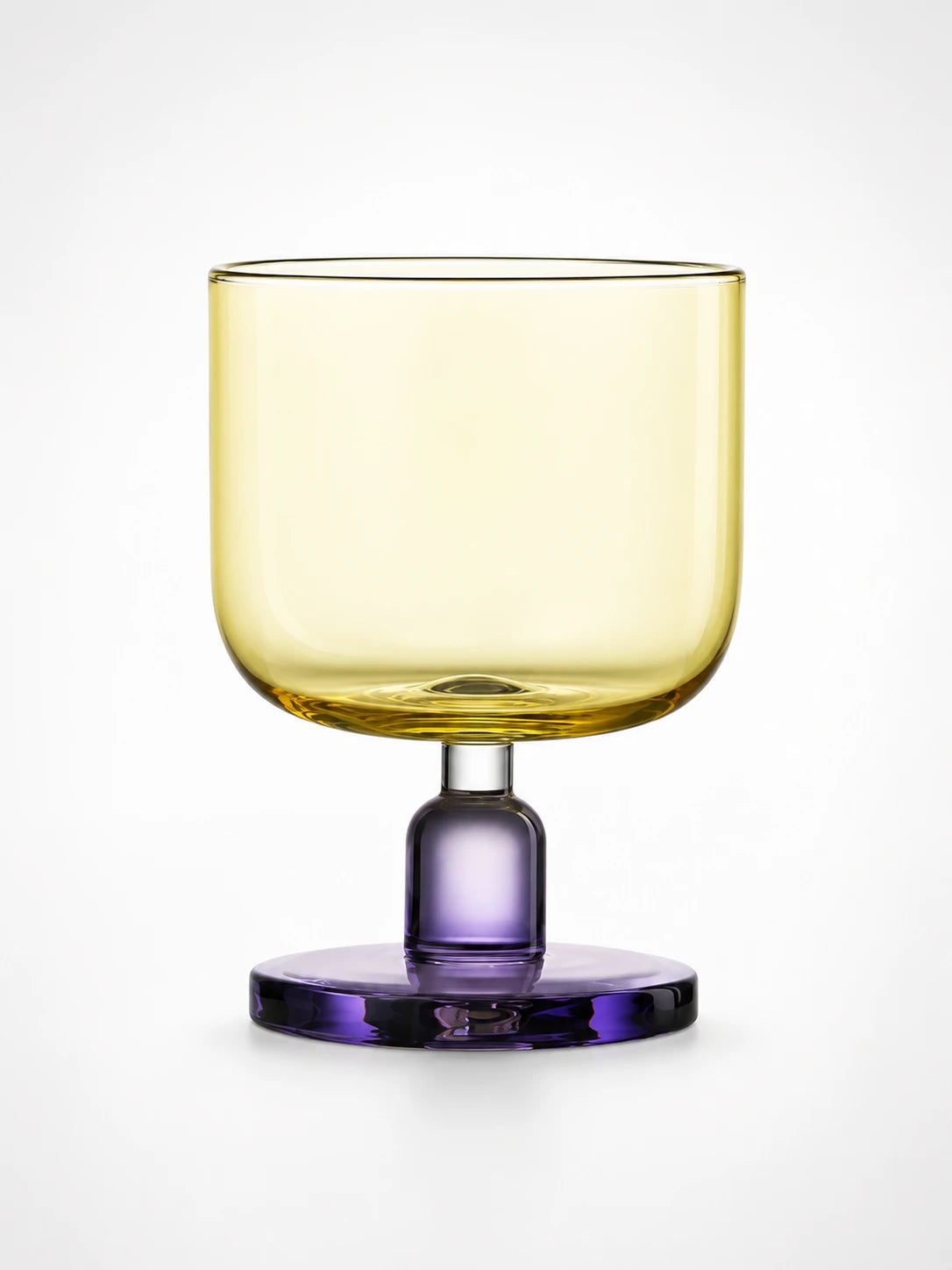 yellow glass tumbler with a purple stem and round base