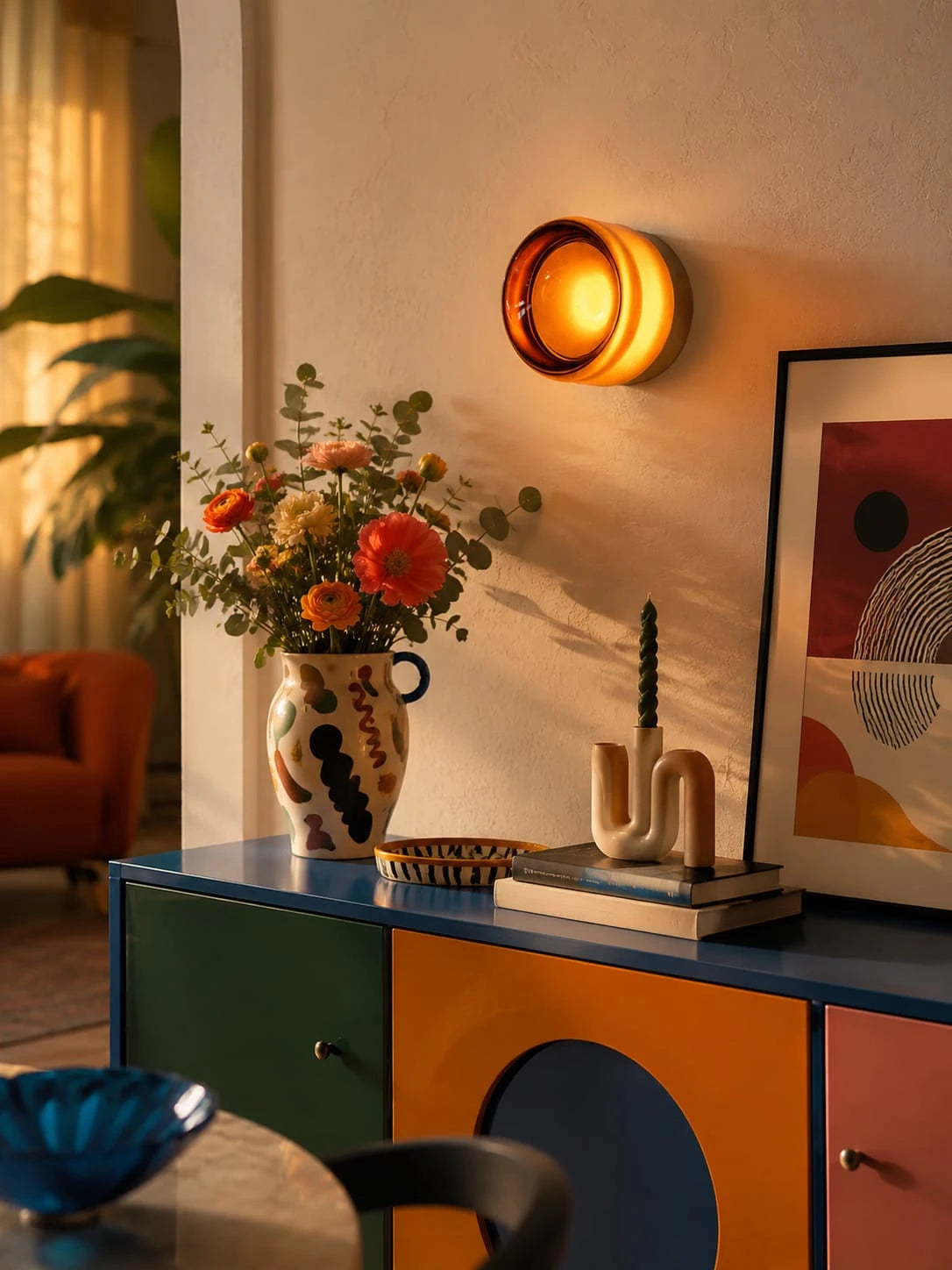amber acrylic disk wall lamp glowing in a hallway