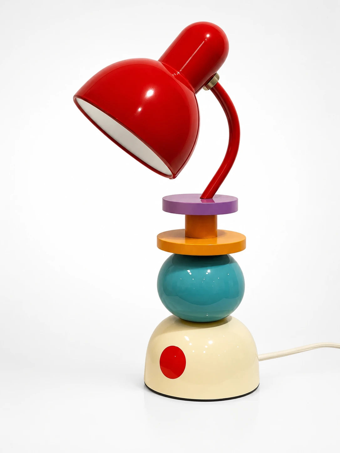 red dome desk lamp on a stacked orb base in purple, orange, teal and cream