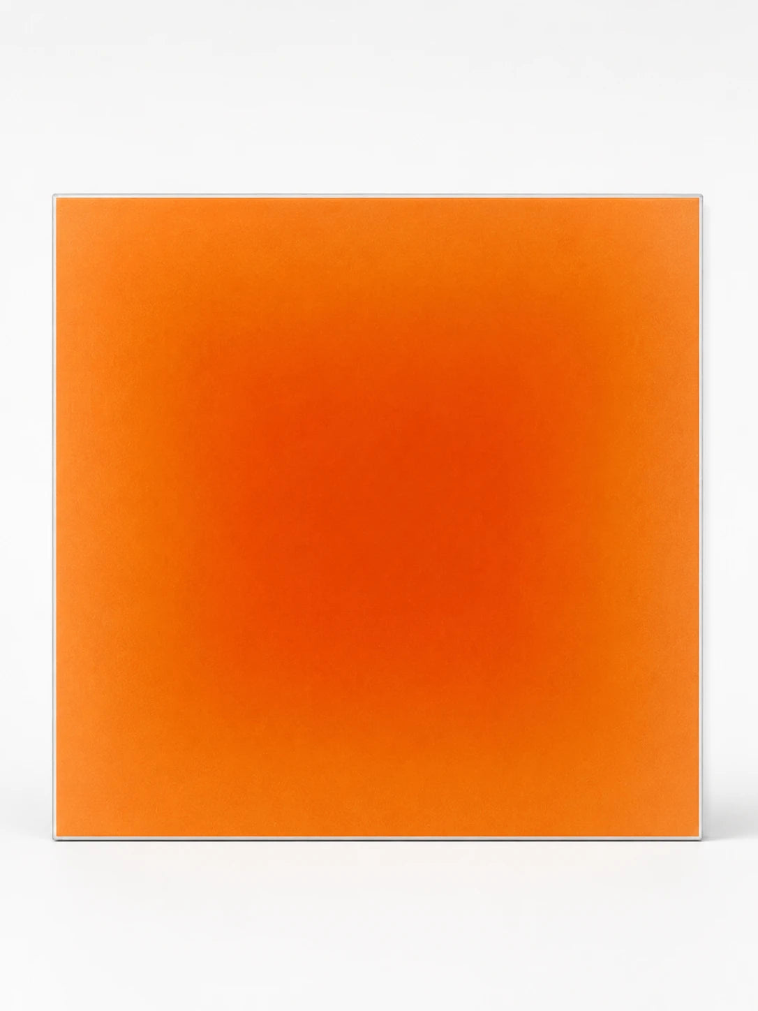 square felt panel with a bold orange radial gradient fading to pale peach at the edges
