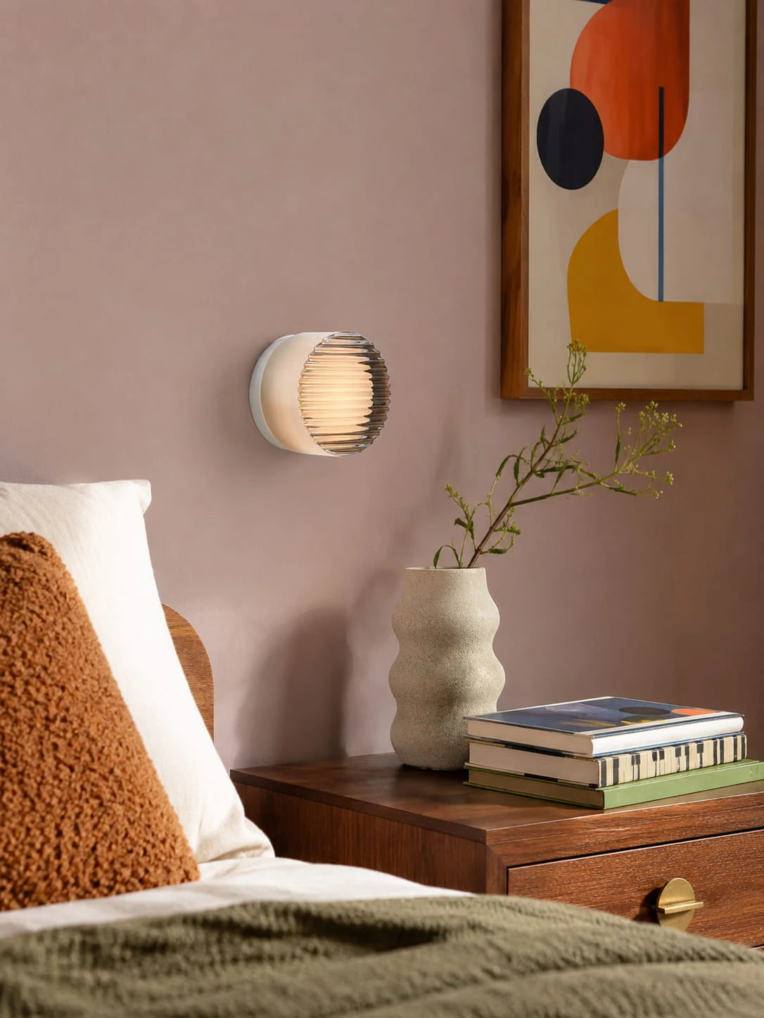 warm amber wall lamp mounted flush on a wall