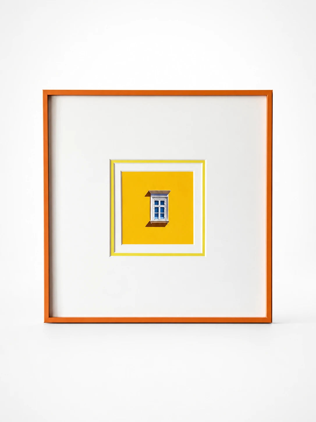 mini canvas print of a white window on a yellow wall, wide white mat inside a slim orange frame