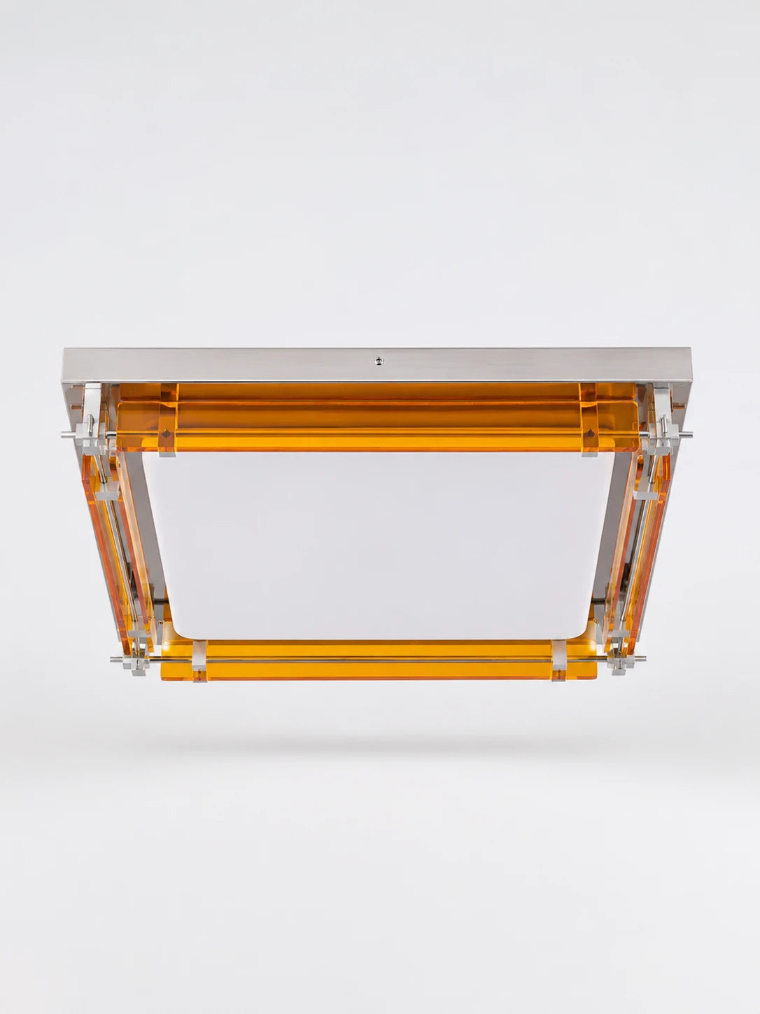 square flush mount ceiling light with stepped amber acrylic slats, chrome rods, and white opal center diffuser