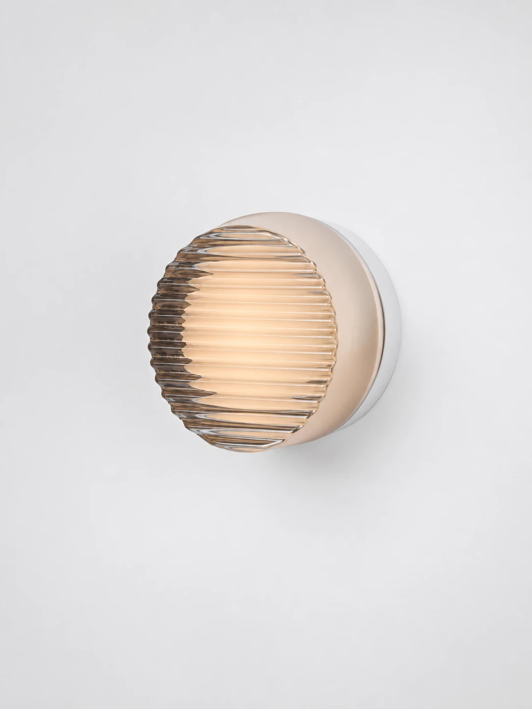 warm amber wall lamp mounted flush on a wall