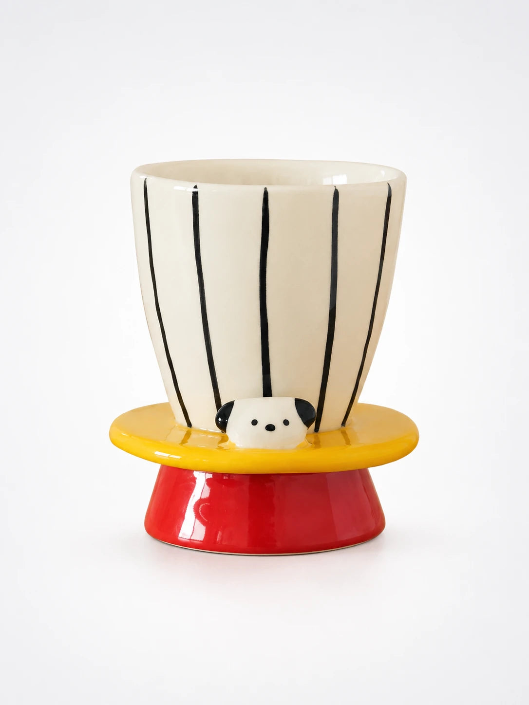 cream pinstriped ceramic goblet with yellow brim, peeking puppy face and red pedestal foot