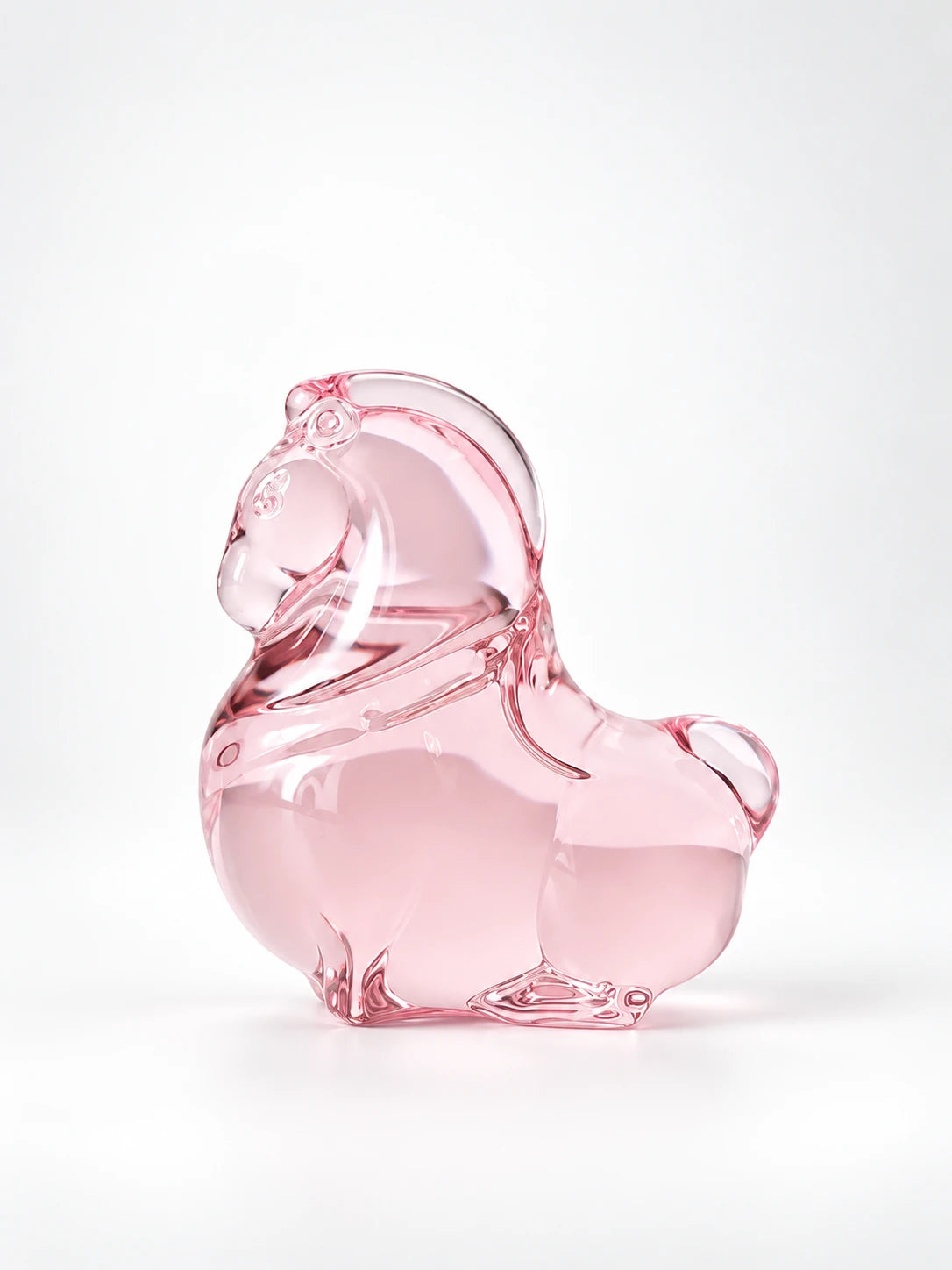 Sakura pink glazed glass pony figurine, studio shot