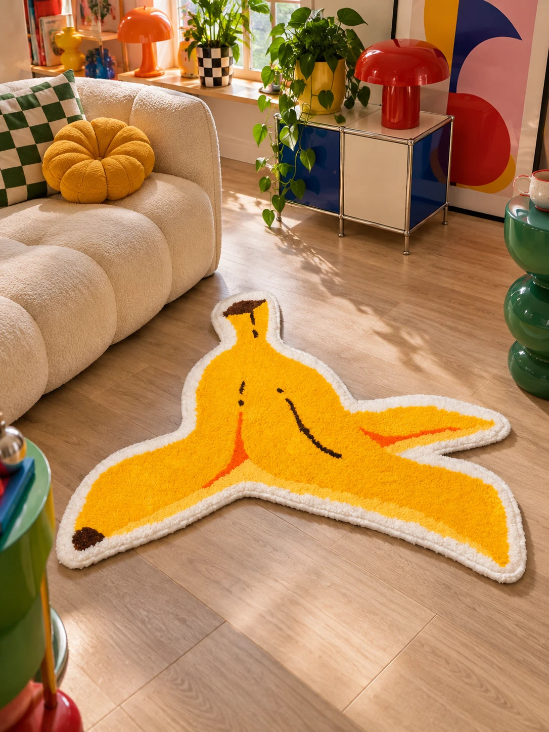 Plush banana peel mat on wood floor in a living room with red mushroom lamp and plants