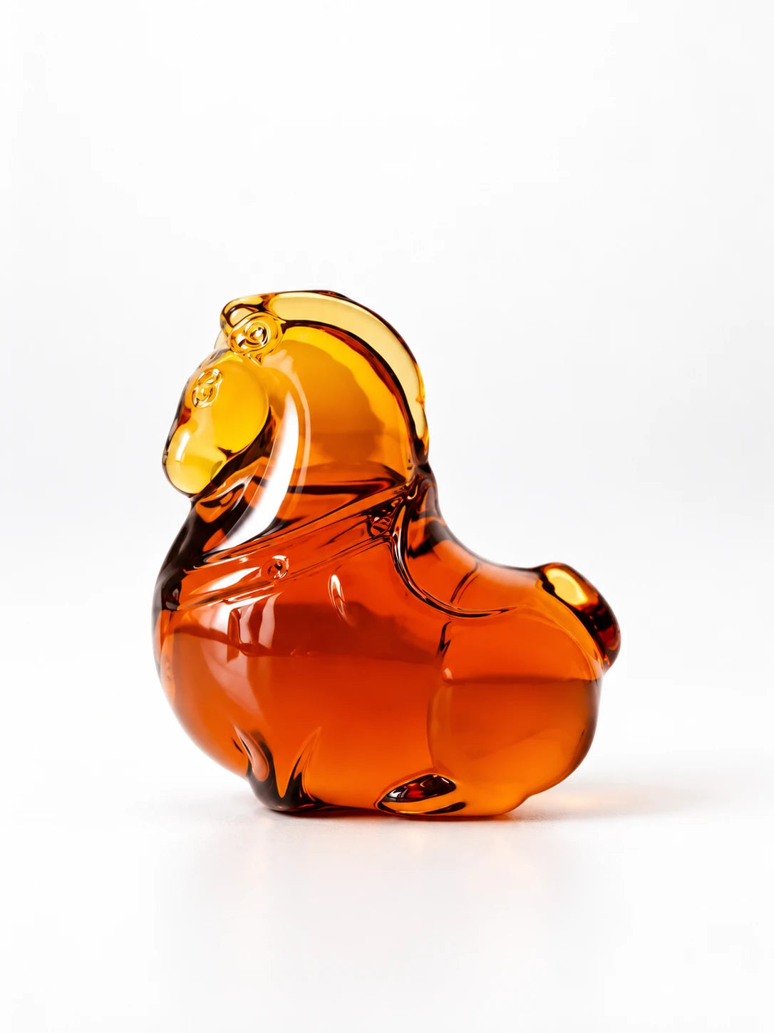 Amber glazed glass pony figurine, studio shot