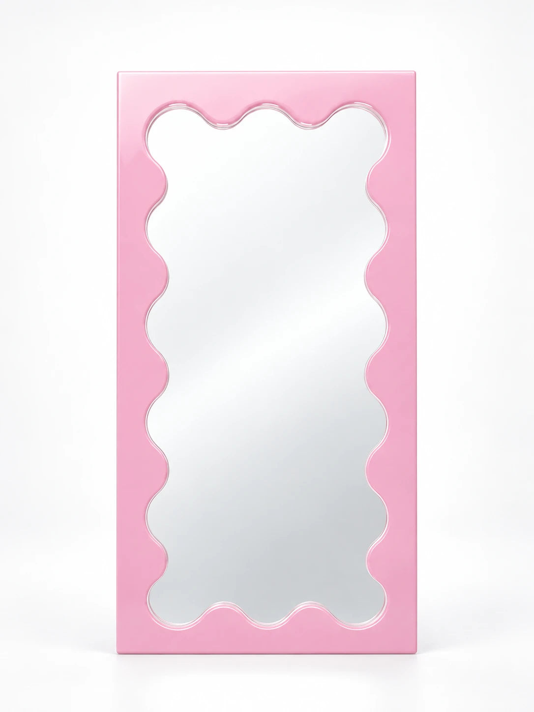 Pink solid wood vanity mirror with wavy scalloped inner frame, studio shot