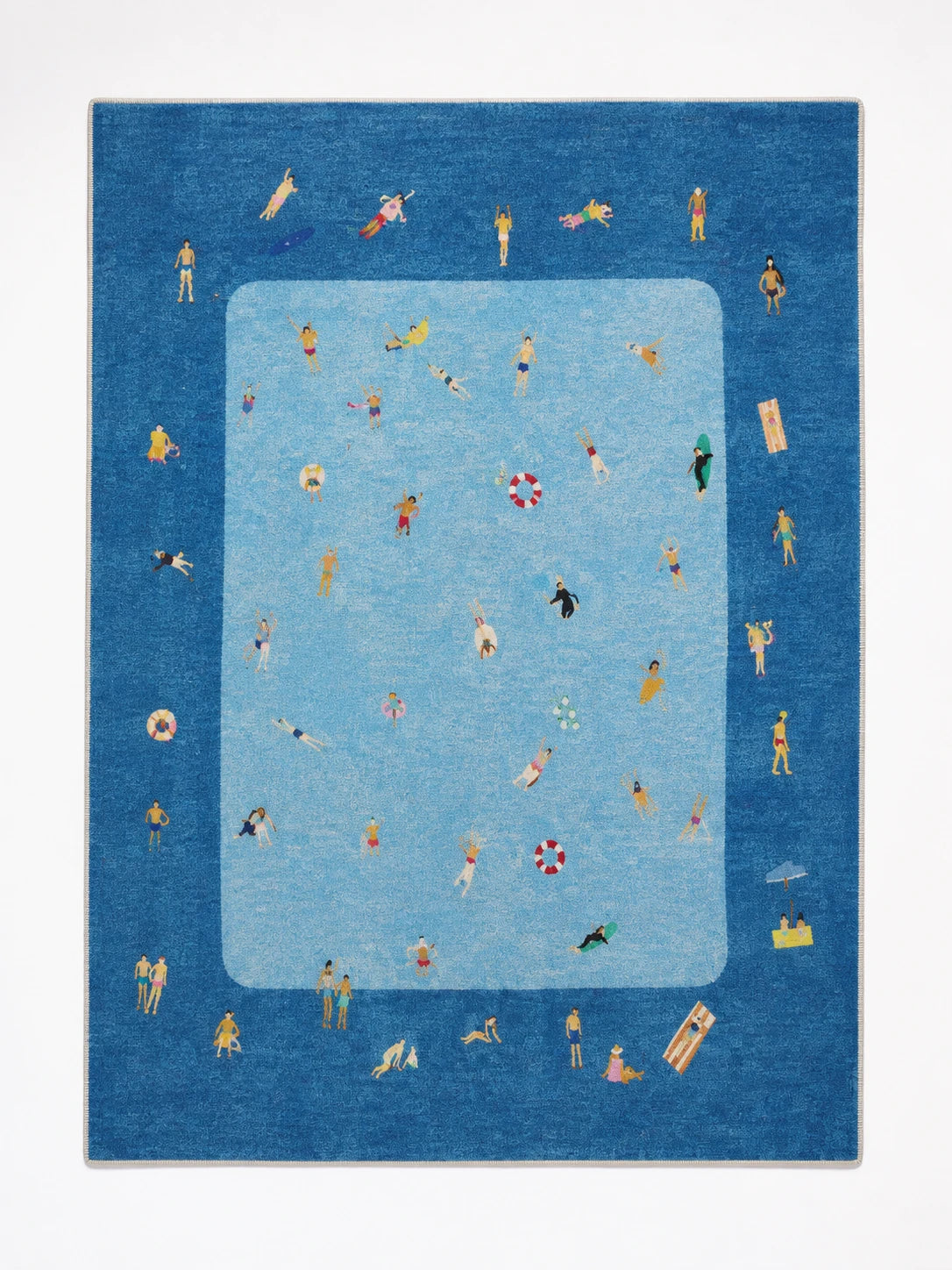 denim blue pool scene area rug with tiny swimmers and sunbathers around a light blue pool