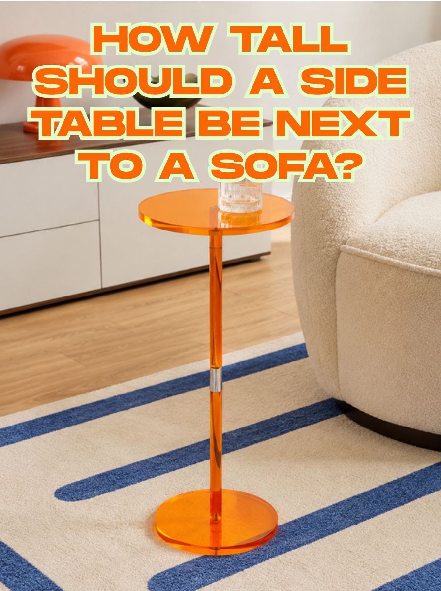 Slim orange acrylic pedestal side table holding a glass beside a cream boucle armchair on a striped rug, with the title How Tall Should a Side Table Be Next to a Sofa?