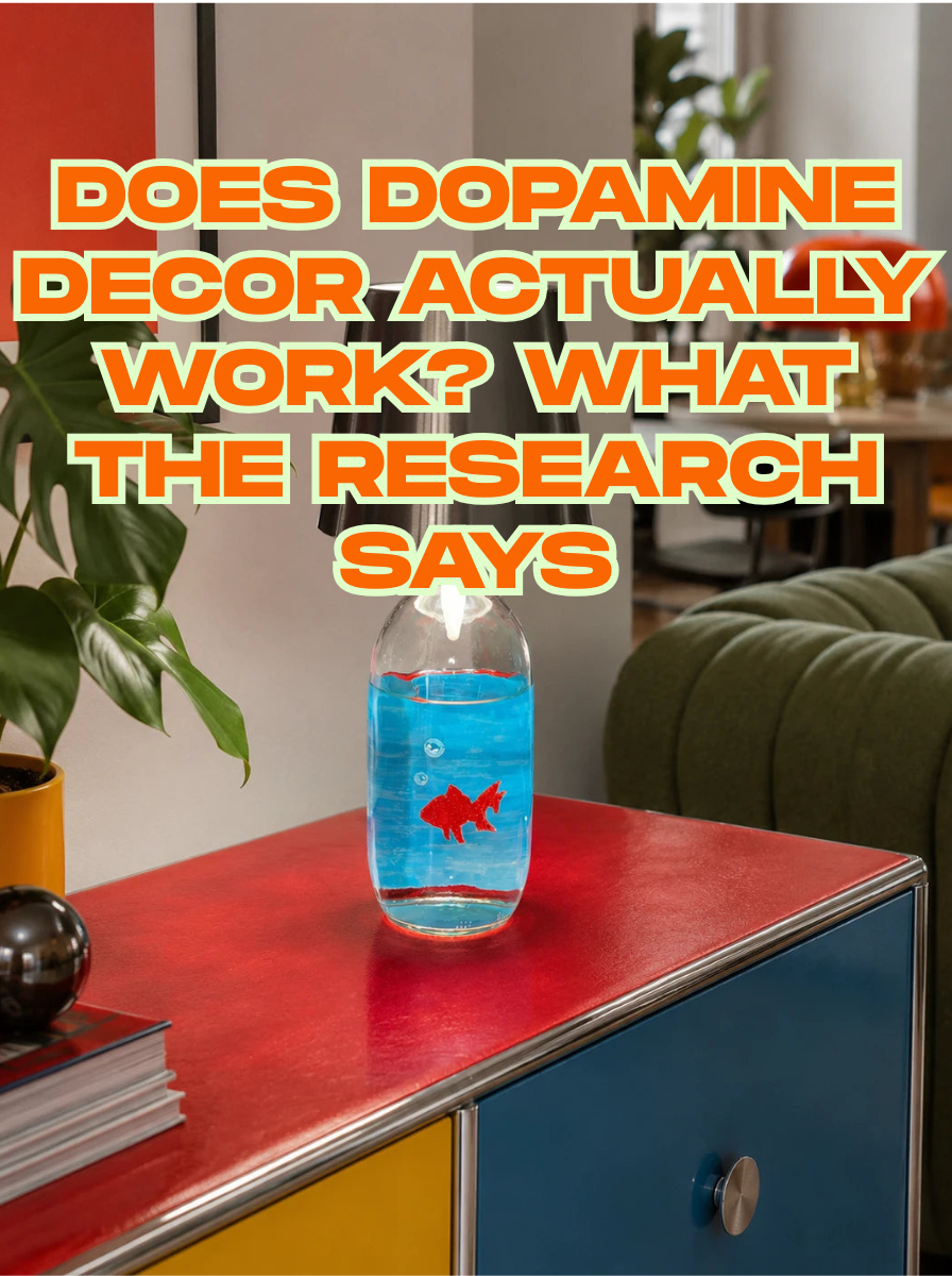 Hand-painted goldfish bottle lamp glowing on a red and blue color-blocked credenza in a colorful dopamine decor living room