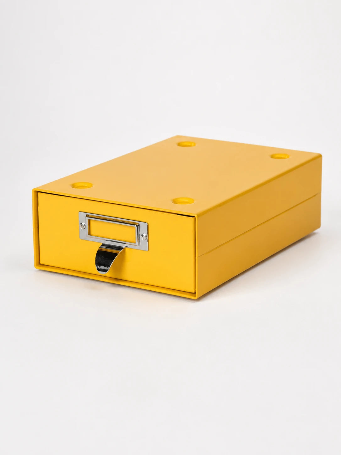 yellow steel desktop storage drawer with chrome label frame and curved pull tab