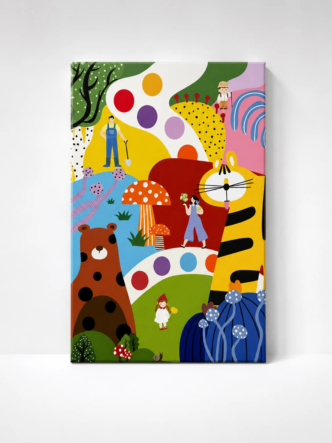 colorful whimsical wall art with a giant orange tiger, brown bear, and red mushrooms on polka-dot hills with tiny figures
