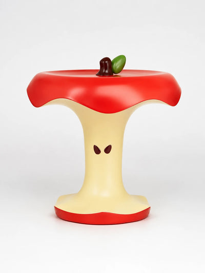 glossy red and cream apple core side table with seed details and stem and leaf accent on top