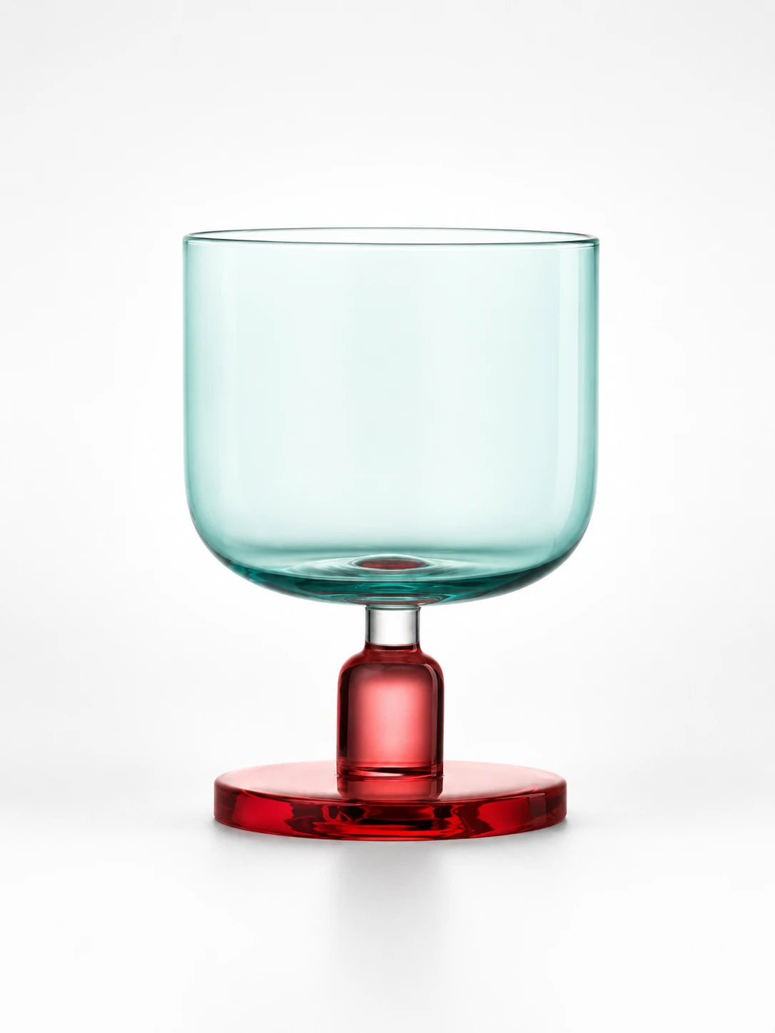 aqua glass tumbler with a red stem and round base