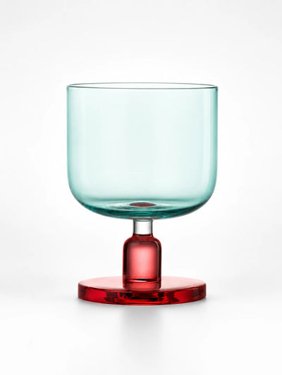 aqua glass tumbler with a red stem and round base