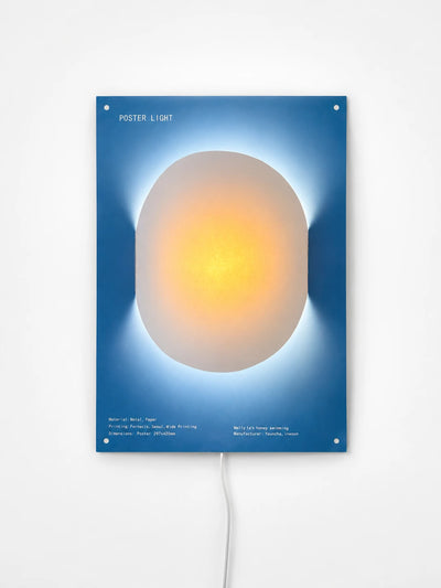 blue backlit poster wall light with a warm glowing orange oval at its center, studio shot