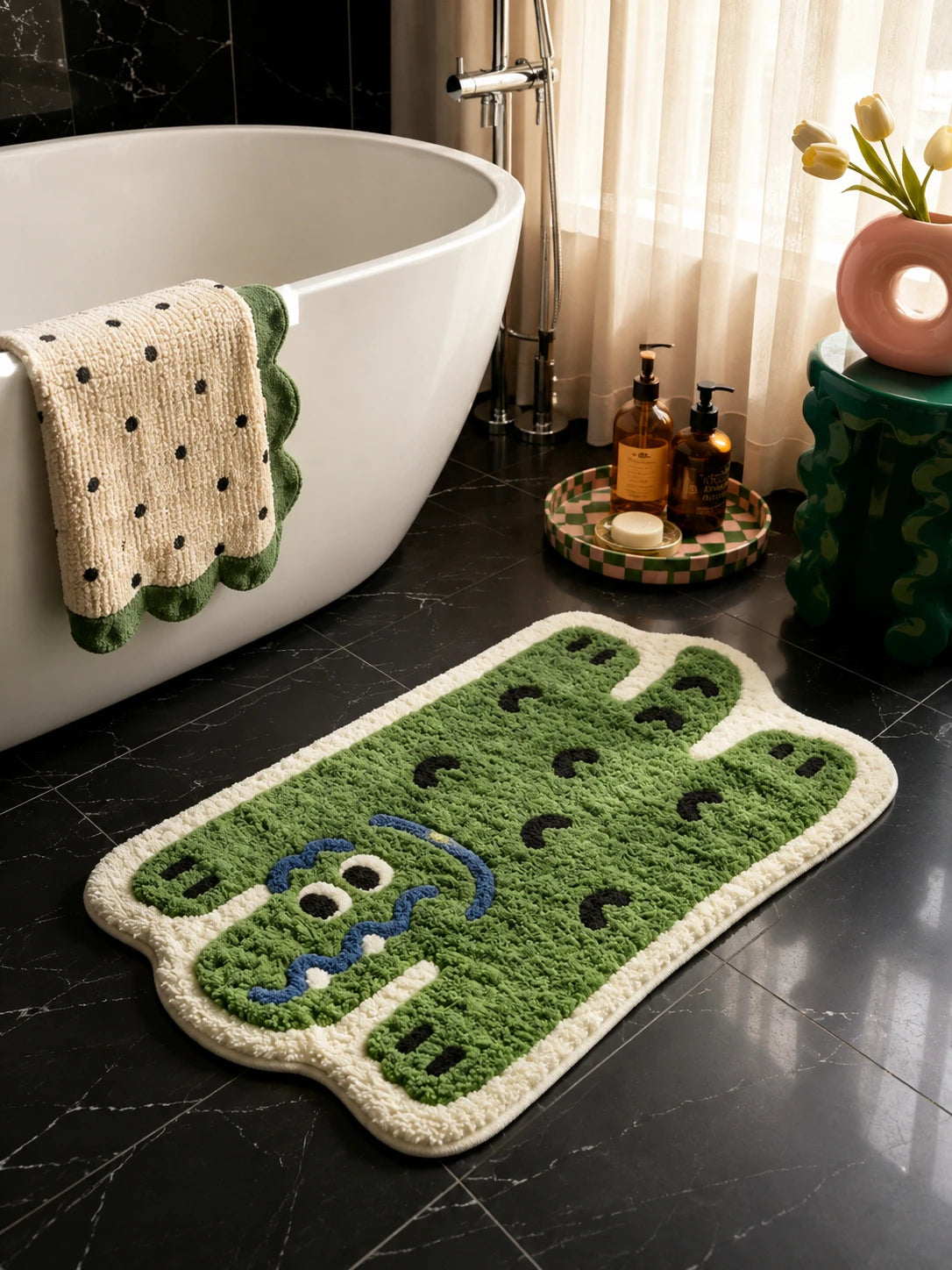tufted alligator mat on dark marble floor beside a white freestanding bathtub