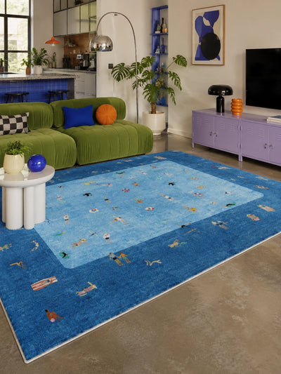 aerial pool scene rug with tiny swimmers beside a green velvet sofa in an open living room