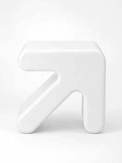 glossy white rotomolded plastic stool shaped like a chunky arrow pointing up and to the right