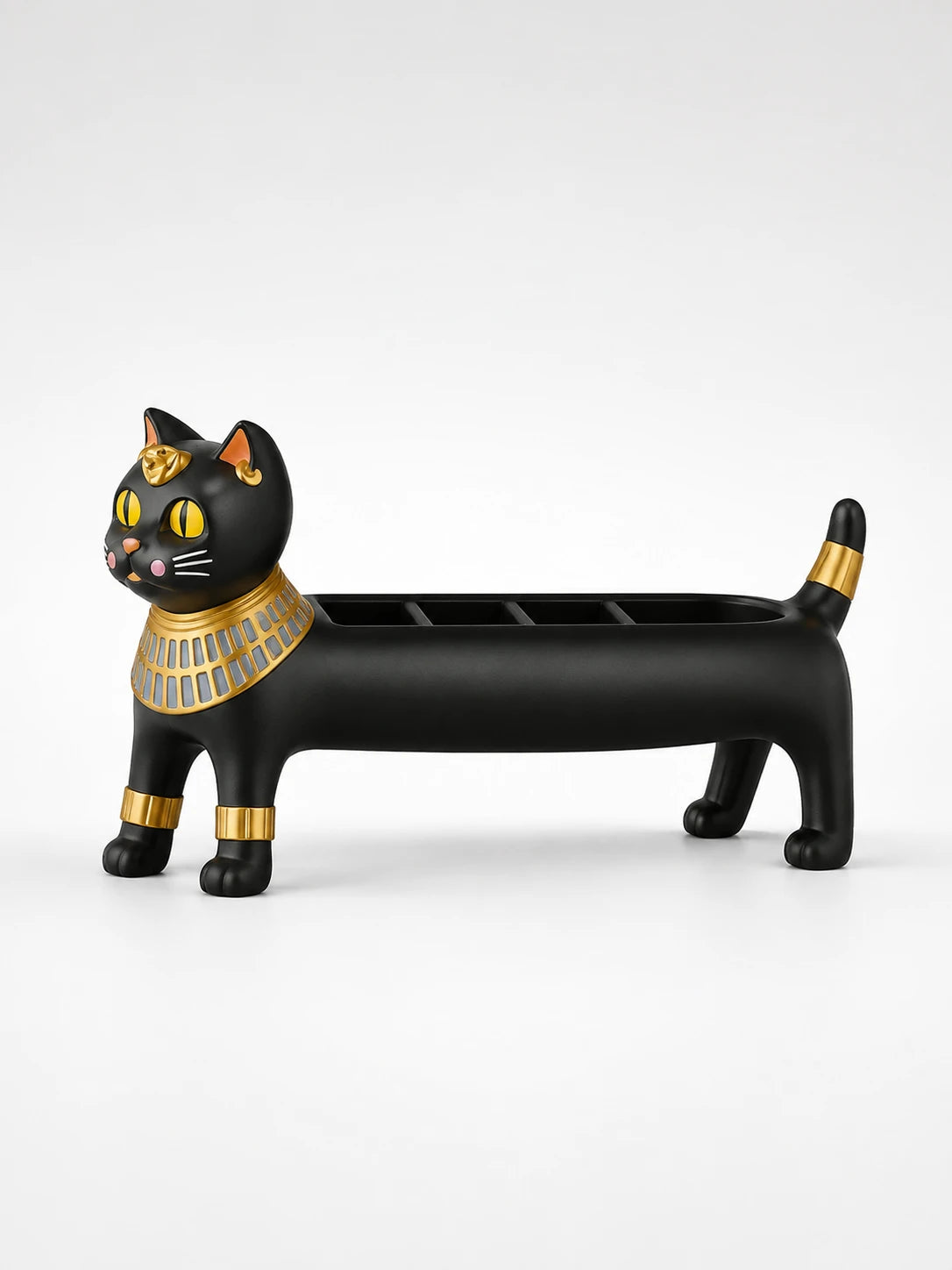 matte black resin Egyptian cat jewelry holder with a gold collar and cuffs and open compartments along its back