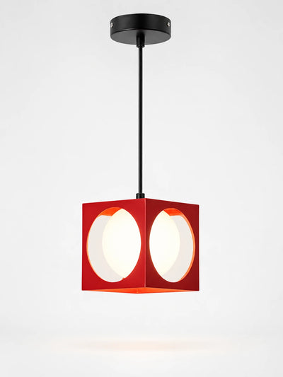 red cube pendant light with circular cutouts revealing a white opal glass globe, hanging from a black cord