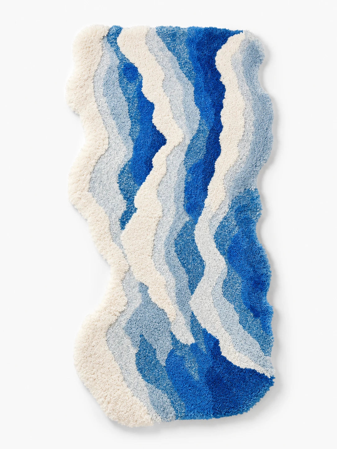 free form blue ocean wave bedside rug with raised cream shag foam bands and gradient blue plush pile