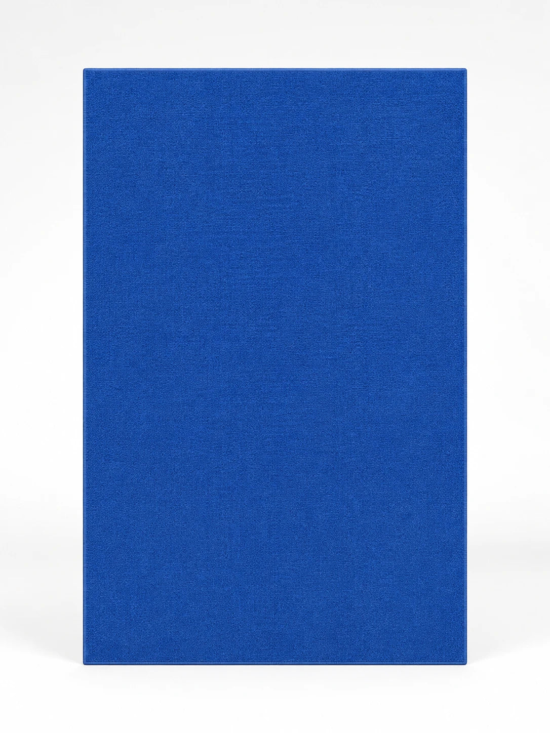 solid cobalt blue low-pile rectangular rug photographed flat on a white background