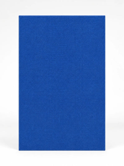 solid cobalt blue low-pile rectangular rug photographed flat on a white background