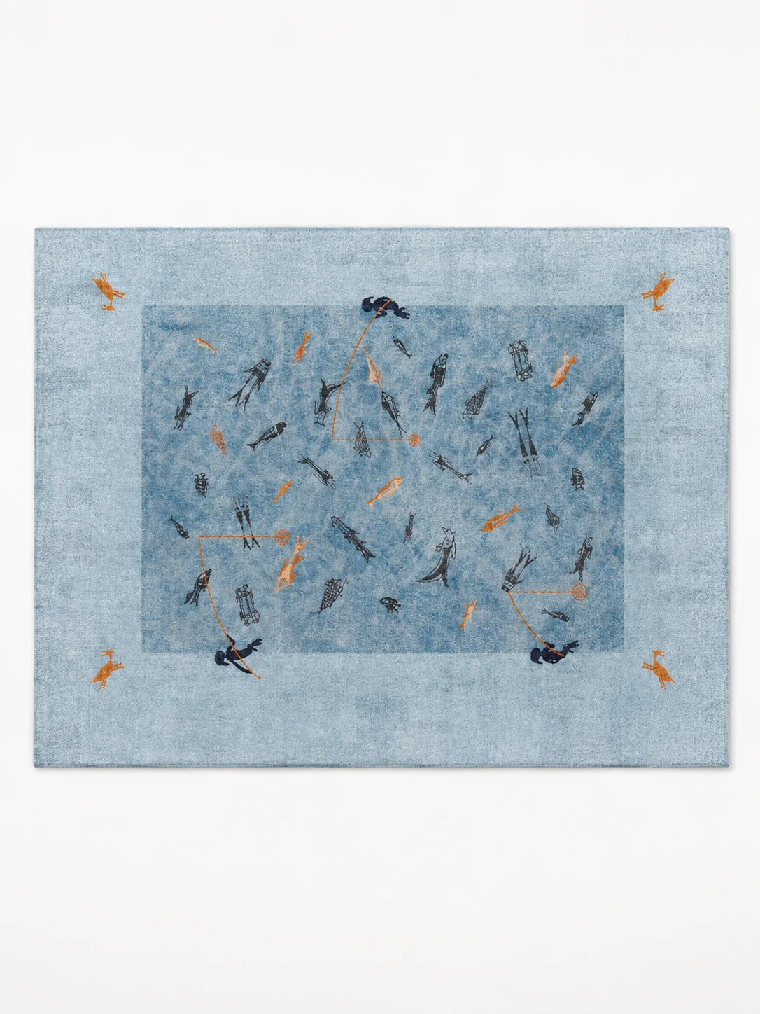 dusty blue washable rug with navy and orange folk fishing pictographs and a pale border