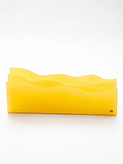 pudding yellow frosted acrylic desktop organizer with wavy layered panels on a white background