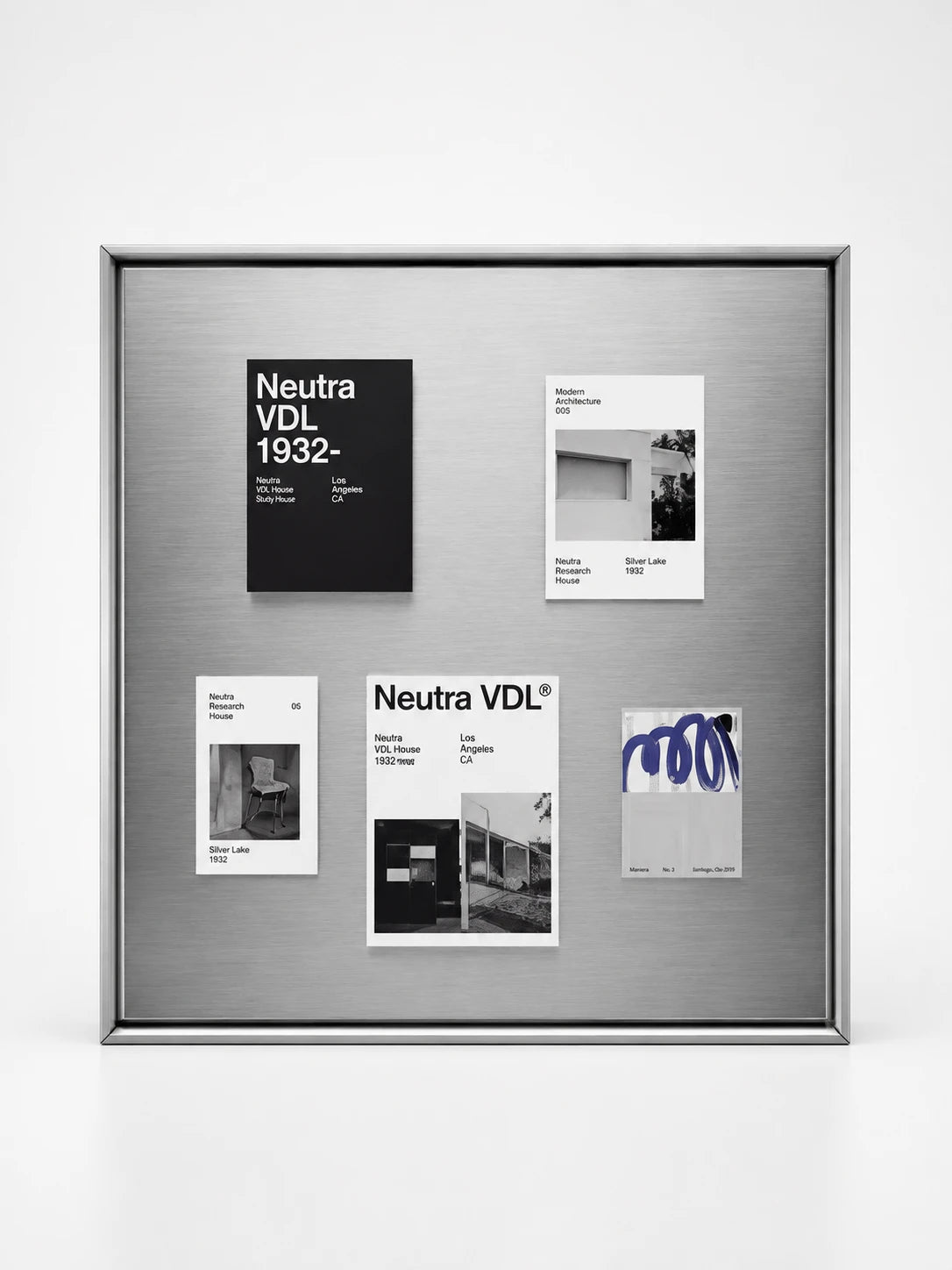 brushed steel magnetic board in a slim silver frame styled with black and white architecture cards