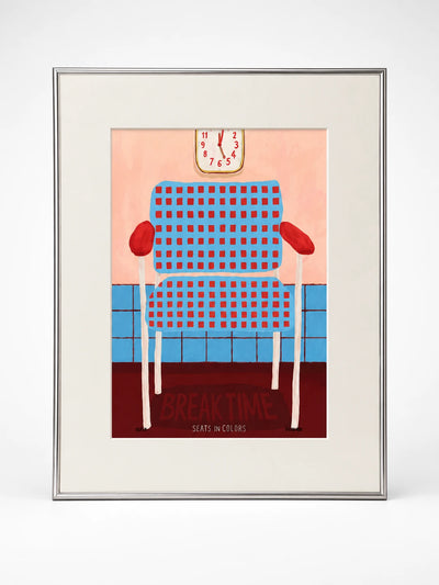 Framed art print of a blue armchair with red grid pattern under a wall clock, lettered Break Time, silver frame