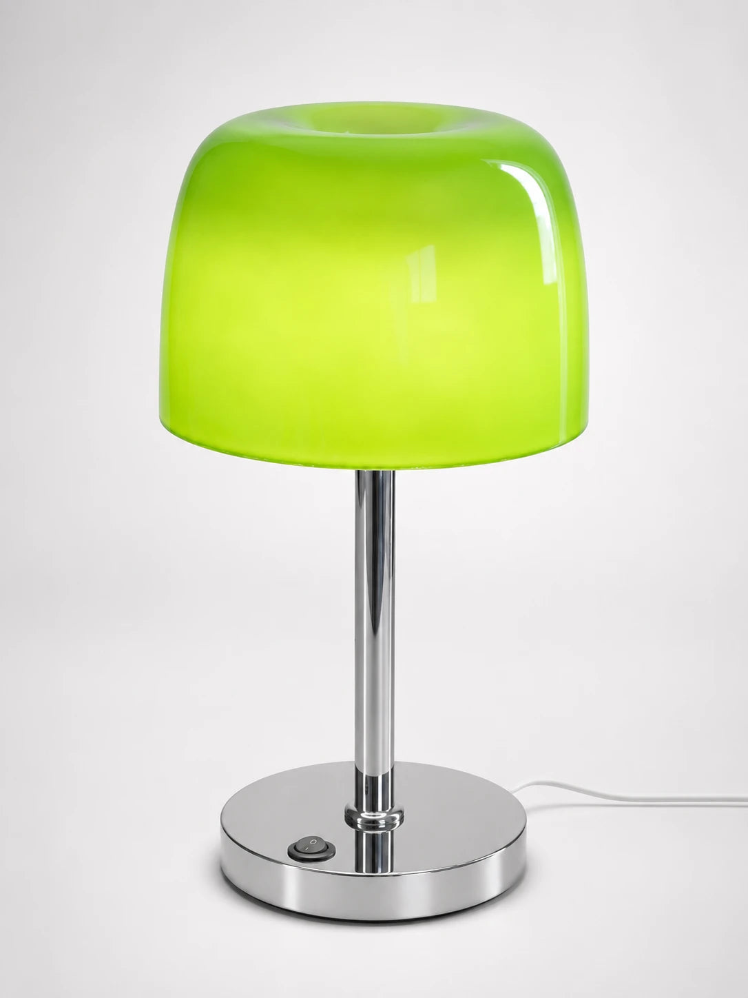 Lime green glass mushroom table lamp with a squared cushion dome on a polished chrome stem and disc base