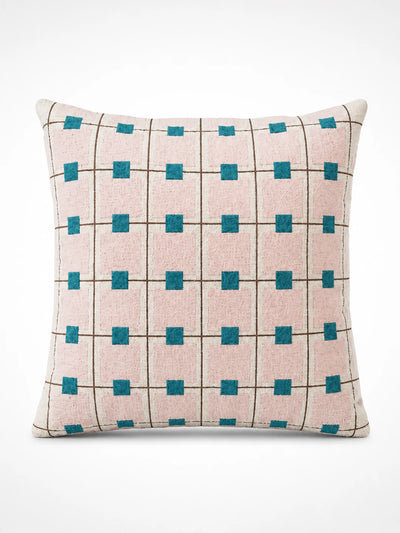 blush-pink grid throw pillow with thin brown lines and teal squares at each intersection