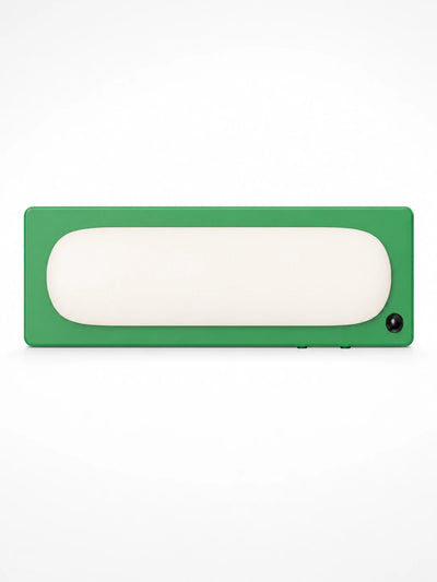 grass green cordless bar light with a rounded white pill diffuser and black motion sensor dot