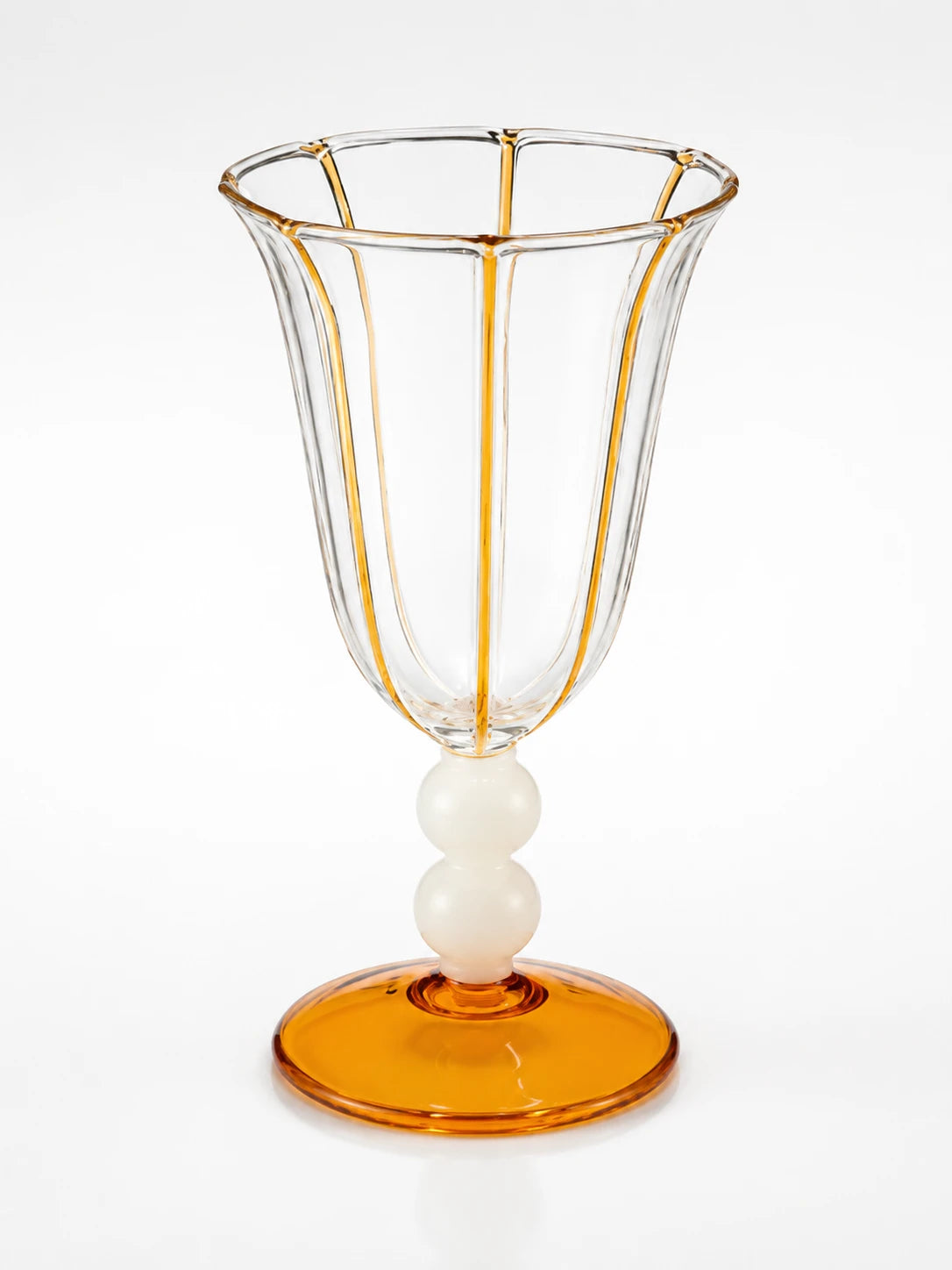 clear goblet with amber stripe piping on fluted panels, ivory double ball stem and amber disc foot
