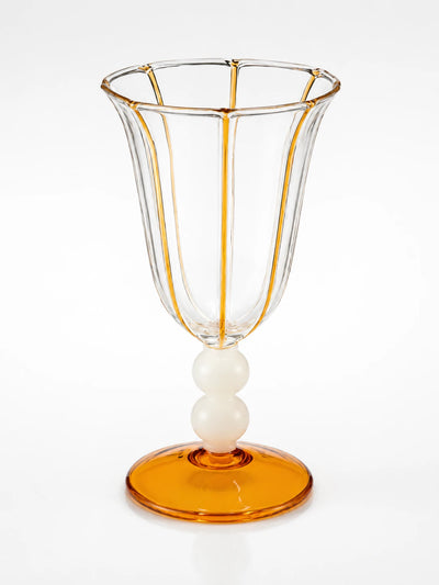 clear goblet with amber stripe piping on fluted panels, ivory double ball stem and amber disc foot