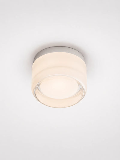 warm amber wall lamp mounted flush on a wall