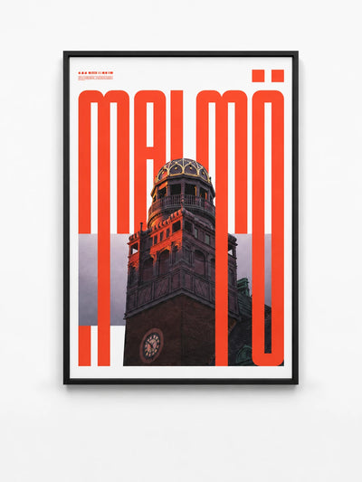 framed typographic wall art with the red word Malmo over a photo of an ornate clock tower