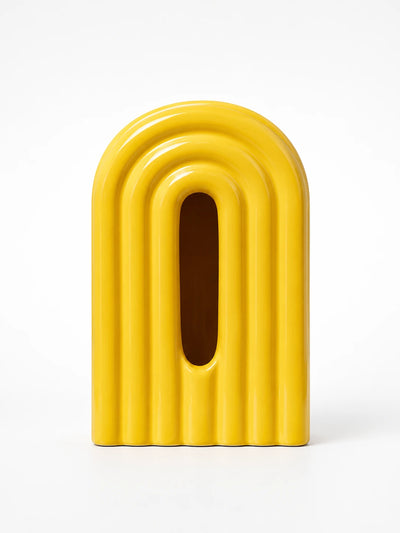 bright yellow ceramic rainbow arch tissue box cover with front tissue slot on white background