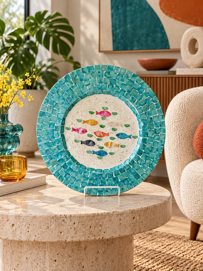 Turquoise seashell tray on a travertine side table with yellow flowers and monstera