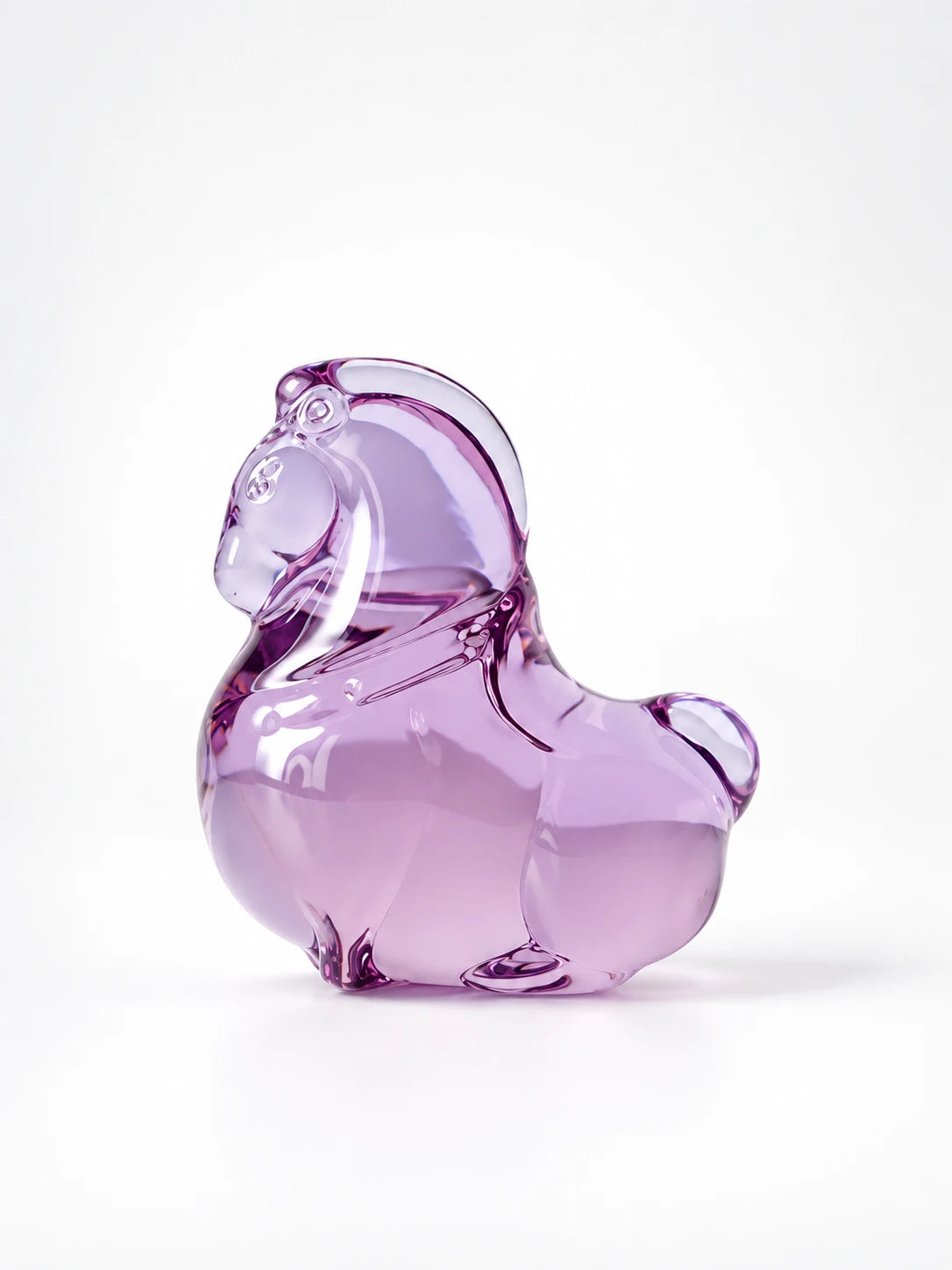 
Soft purple glazed glass pony figurine, studio shot