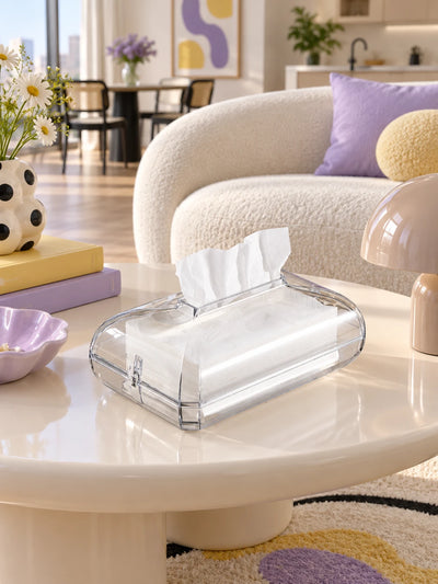 Clear acrylic tissue box on a coffee table in a lavender living room