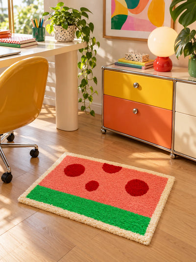 watermelon flocked mat in a living room beside a boucle sofa and red side table