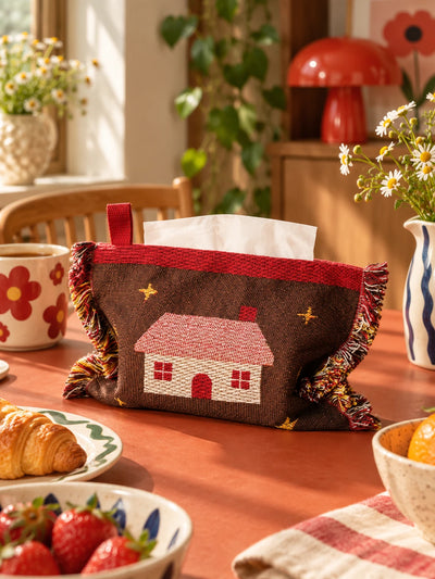 brown cabin knitted tissue pouch on a dining table