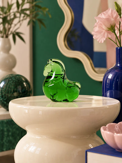 Colorful glazed pony figurine in a bright styled interior