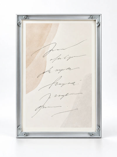 flat silver aluminum poster frame with corner plates and abstract script insert, studio view