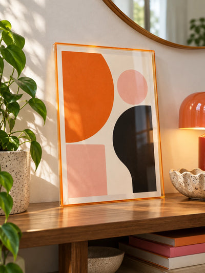 blue acrylic frame with abstract print styled on a shelf with books